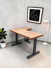 Load image into Gallery viewer, Height-adjustable L-shaped standing desk in natural solid rubberwood with black steel legs