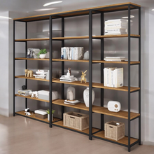 Load image into Gallery viewer, Bookshelf with wooden shelves and black metal frame in a room setting.