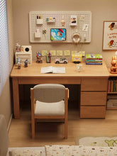 Load image into Gallery viewer, Solid wood study table with 3 drawers on the right, wooden chair and pegboard organiser in a child's bedroom