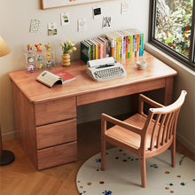 Load image into Gallery viewer, Front view of 3-drawer solid wood study desk with slatted wooden chair on a floral round rug