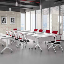 Load image into Gallery viewer, Modern conference room with white tables and red chairs near large windows.