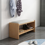 Solid wood shoe bench with cushioned PU leather seat and open storage shelf in entryway