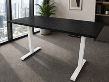 Load image into Gallery viewer, Black laminate adjustable standing desk with white legs