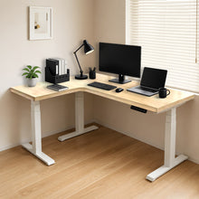Load image into Gallery viewer, Natural solid rubberwood L-shaped standing desk with white steel legs in a bright home office