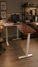 Load image into Gallery viewer, Side view of the L-shaped standing desk showing the 4 cm walnut-finish top and white steel legs