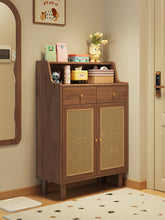 Load image into Gallery viewer, Rattan shoe cabinet in black walnut finish styled in an entryway corner