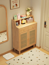 Load image into Gallery viewer, Rattan shoe cabinet in natural wood finish in a Singapore entryway beside a mirror