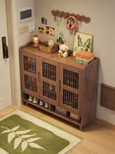 Load image into Gallery viewer, Slatted-door ventilated shoe cabinet in black walnut, 120cm model beside the front door