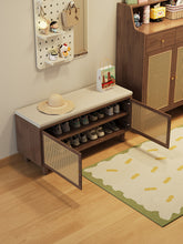 Load image into Gallery viewer, Shoe cabinet with seat in black walnut, doors open showing two tiers of shoes below the cushioned top