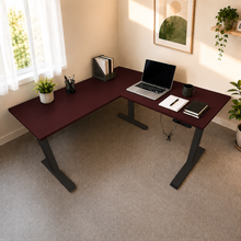 Load image into Gallery viewer, ErgoFlex L-shaped standing desk in Mahogany laminate with black legs, set into a home office corner