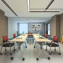 Load image into Gallery viewer, Modern office conference room with tables, chairs, and decor.