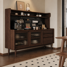 Load image into Gallery viewer, Angled view of dark walnut sideboard cabinet with coffee bar, black pegboard, fluted glass doors and drawers in a dining room.