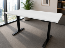 Load image into Gallery viewer, White laminate adjustable standing desk with black legs, front view